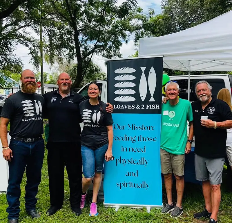 5 Loaves & 2 Fish volunteers and supporters at a fundraising gathering